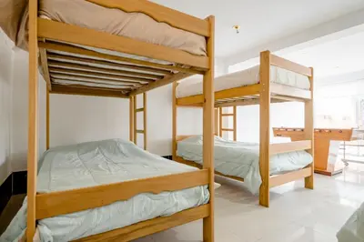 a bedroom with two bunk beds in a room at casa de campo en cieneguilla in Cieneguilla