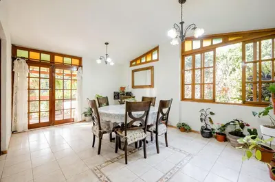 a dining room with a table and chairs at casa de campo en cieneguilla in Cieneguilla