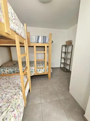 a bedroom with two bunk beds in a room at Departamento en Playa San Bartolo Con terraza in San Bartolo