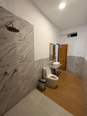 a bathroom with a toilet and a sink at The Wismont club & hotel in La Merced