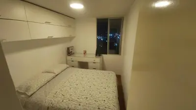 a small bedroom with a bed and a window at Departamento con Vista al Mar San Miguel in Lima