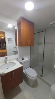 a bathroom with a toilet and a sink and a shower at Departamento con Vista al Mar San Miguel in Lima