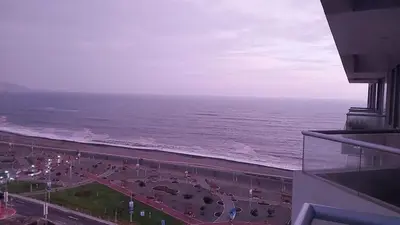 a view of the ocean from a balcony of a building at Departamento con Vista al Mar San Miguel in Lima