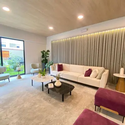 a living room with a couch and a table at Departamento de estreno en San Isidro in Lima