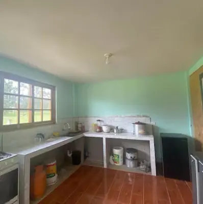 a kitchen with a sink and a counter top at Casa de campo Miraflores in Oxapampa