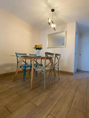 a dining room with a table and chairs at Hermoso departamento estreno céntrico in Lima
