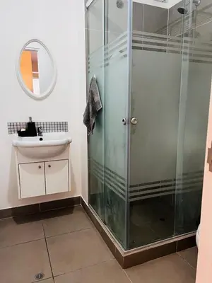 a bathroom with a shower and a sink at Hermoso departamento estreno céntrico in Lima