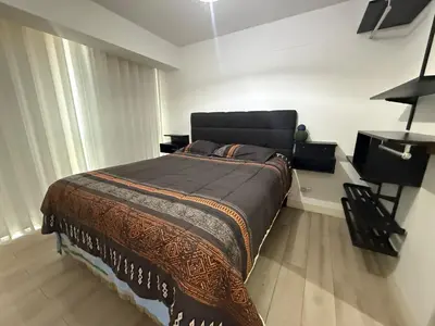 a bedroom with a large bed in a room at Rest and comfort in San Isidro in Lima