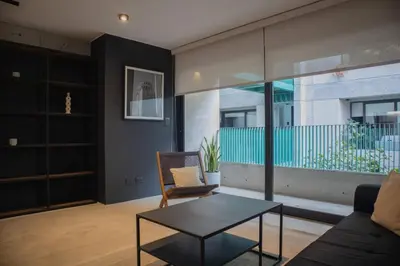 a living room with a couch and a table at Arrieta by Wynwood House in Lima