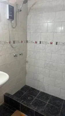 a bathroom with a shower and a sink at Curazao in Punta Hermosa