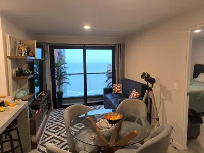 a living room with a view of the ocean at Departamento con vista al mar en Lima in Lima