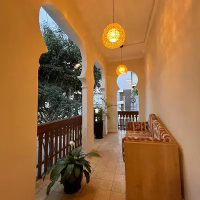 a hallway of a house with a bench and a window at Andara Boutique Hotel in Lima