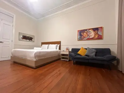 a bedroom with a bed and a couch at Andara Boutique Hotel in Lima
