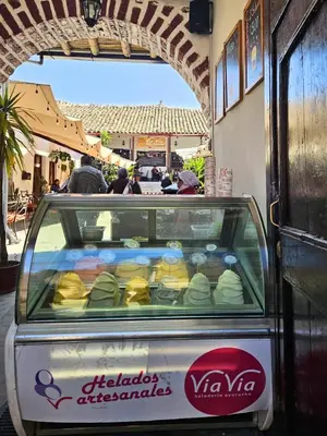 a car parked in front of a store with food at ViaVia Ayacucho in Ayacucho
