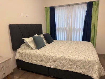 a bedroom with a bed and a window at MONTERRICO POLO APARTS #21 - Dpto 2 Dorm Frente Embajada de USA in Lima