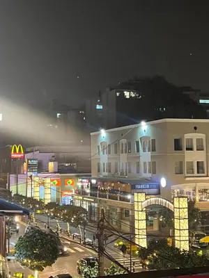 a view of a city at night with a building at MONTERRICO POLO APARTS #21 - Dpto 2 Dorm Frente Embajada de USA in Lima