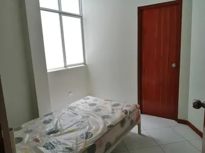 a small bed in a room with a window at Apartamento en Ayacucho in Ayacucho