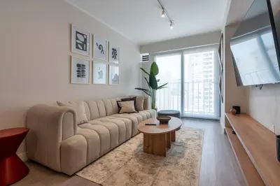 a living room with a couch and a table at 28 de Julio by Geko in Lima