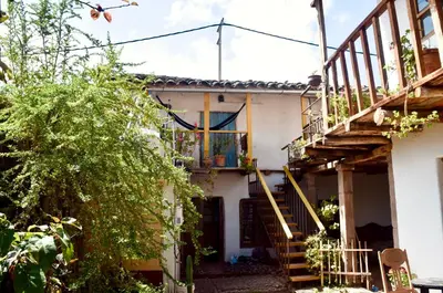 a house with a staircase and a balcony at Casa Takiy in Maras