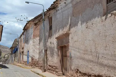 an old stone building on a street at Casa Takiy in Maras