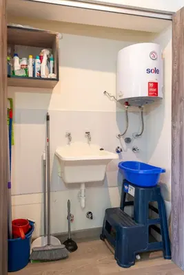 a bathroom with a sink and a mixer at Plaza 27 by Geko in Lima