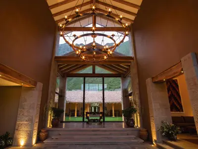 a large chandelier hangs from the ceiling of a building at Inkaterra Hacienda Urubamba in Urubamba