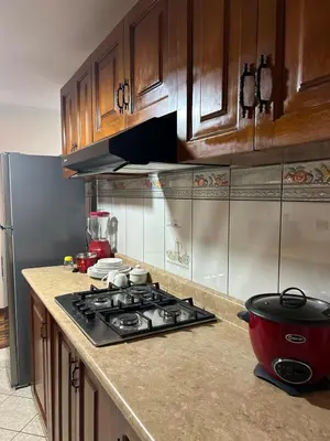 a kitchen with a stove and a pot on the counter at Apartment - US Embassy in Lima