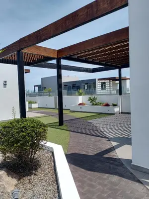 a patio with a wooden pergola at Panoramic Elegante departamento in Lima