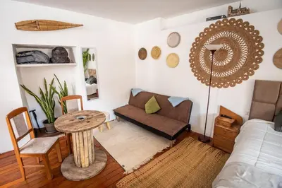 a living room with a couch and a table at Alojamiento en Centro Histórico Cusco in Cusco