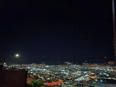 a view of a city lit up at night at Sanblas House in Cusco