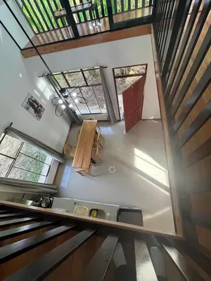 an overhead view of a kitchen in a house with windows at Albano Casa en bosque de conservación privado in Oxapampa
