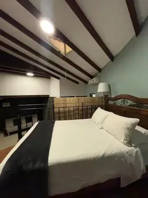 a bedroom with a large white bed in a room at Serendipia Studio Loft in San Isidro 205 in Lima