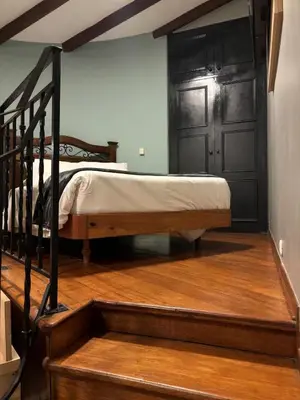a bedroom with a bunk bed and a staircase at Serendipia Studio Loft in San Isidro 205 in Lima