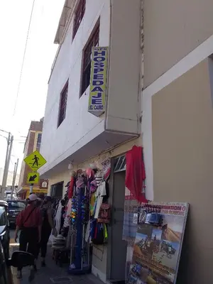 a store with a sign on the side of a building at Hospedaje El Cairo in Ica