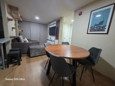 a living room with a table and chairs and a couch at Departamento 3 Dormitorios en Ñaña - Con Cochera in Chosica