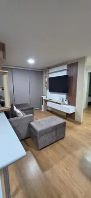 a living room with a couch and a flat screen tv at Departamento 3 Dormitorios en Ñaña - Con Cochera in Chosica