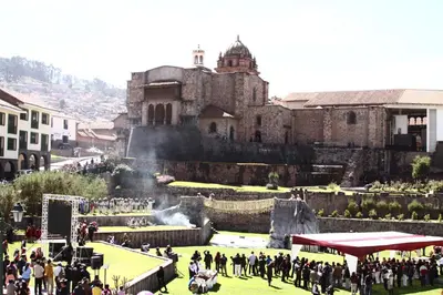 a group of people standing in front of a castle at Hostal Lucerito in Cusco