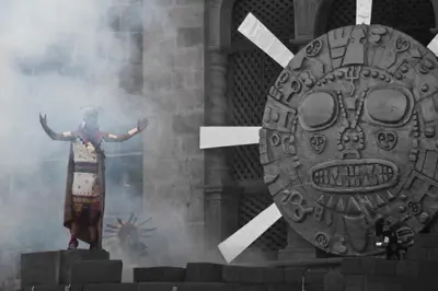 a man standing in front of a skull in a castle at Hostal Lucerito in Cusco