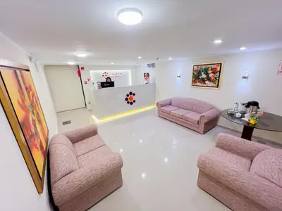 a waiting room with two chairs and a table at Hotel Centro Huancayo in Huancayo