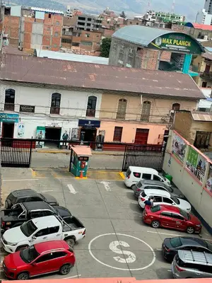 a group of cars parked in a parking lot at Hotel Centro Huancayo in Huancayo