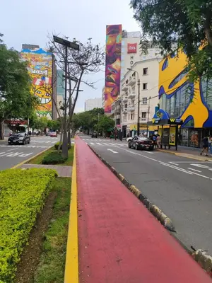 a red and yellow sidewalk on a city street at Habitación acogedora cerca a Larcomar in Lima