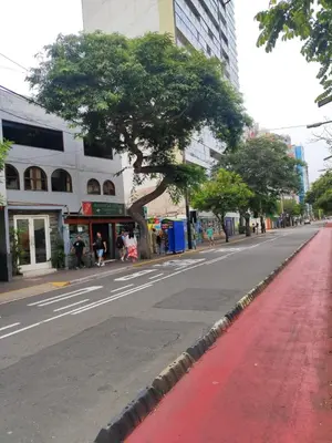 an empty street in a city with buildings at Habitación acogedora cerca a Larcomar in Lima