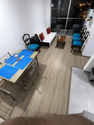 a room with a table and chairs and a couch at Come and have fun with the family in San Bartolo