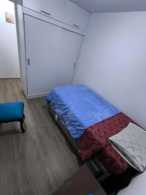 a small bedroom with a bed in a room at Come and have fun with the family in San Bartolo