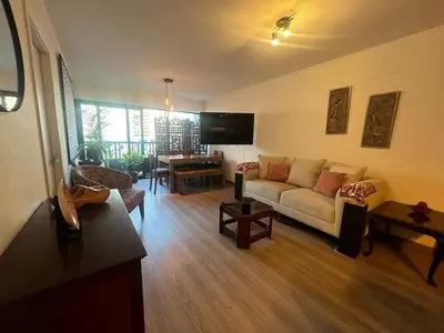 a living room with a couch and a table at Stay, explore and enjoy Lima in Lima
