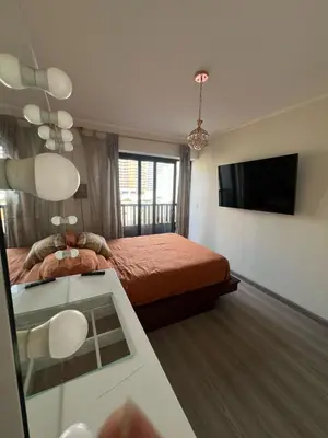 a hotel room with a bed and a television at Stay, explore and enjoy Lima in Lima
