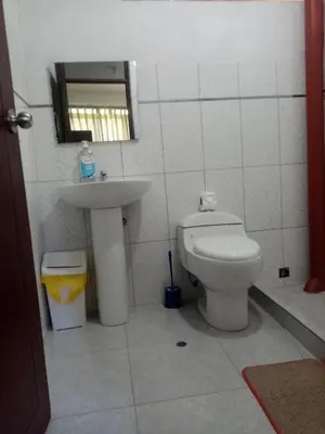 a bathroom with a toilet and a sink at Hostal Aylluq Wasin - Guest House-Casa de Familia in Urubamba
