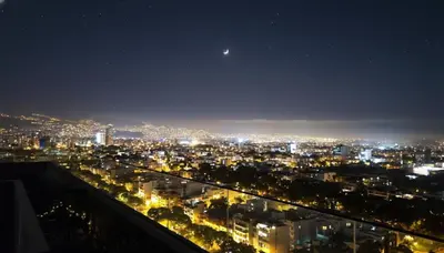 a view of a city at night at Relajar y trabajar en Miraflores in Lima