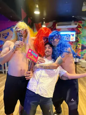 a group of people dressed in costumes posing for a picture at PARTY HOSTEL THAY Miraflores Lima in Lima
