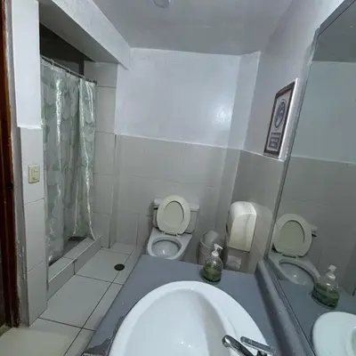 a small bathroom with a sink and a toilet at PARTY HOSTEL THAY Miraflores Lima in Lima